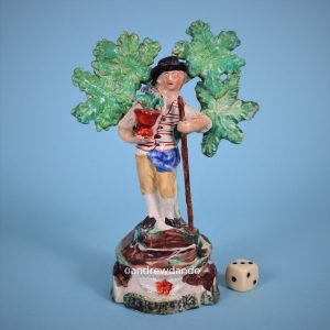 Staffordshire Pottery Figure of a Gardener.
