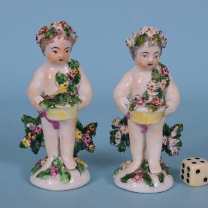 Two Derby Putto Figures.