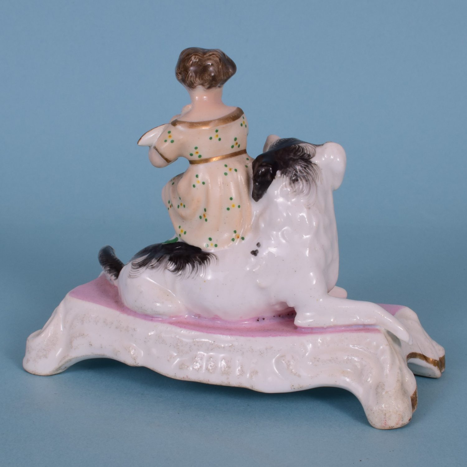 Staffordshire Porcelain Girl Sitting on a Dog.