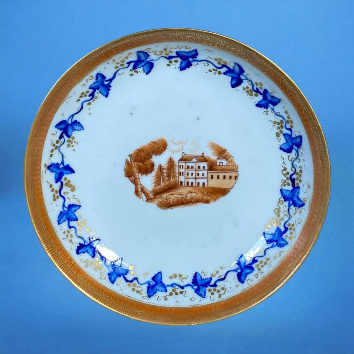 Chinese Export Porcelain Saucer With Country House Scene.