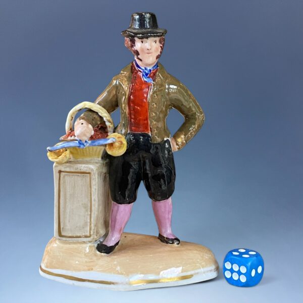 C19th Staffordshire Porcelain Figure of a Fruit Seller.