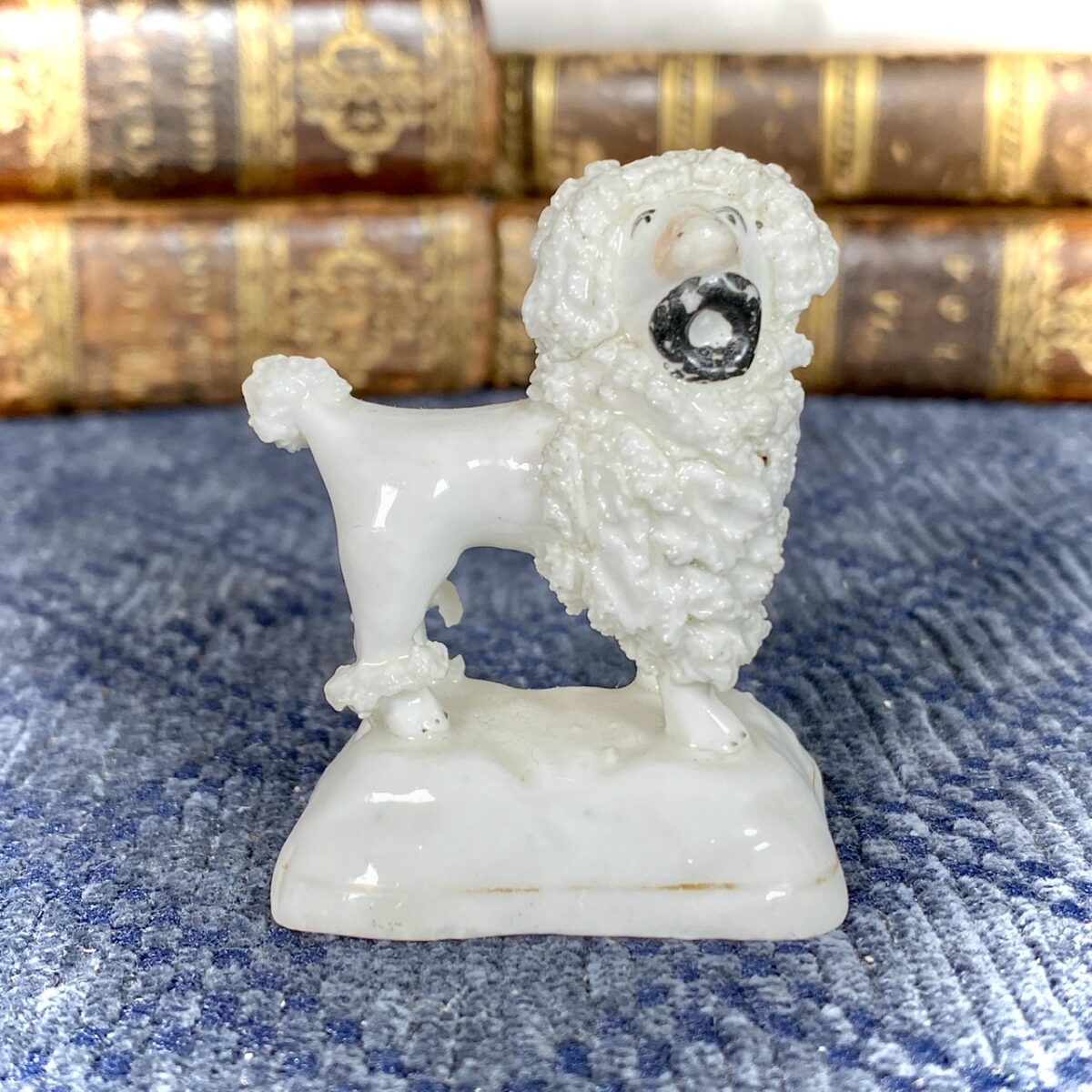 Staffordshire Porcelain Miniature Poodle Holding a Hat.