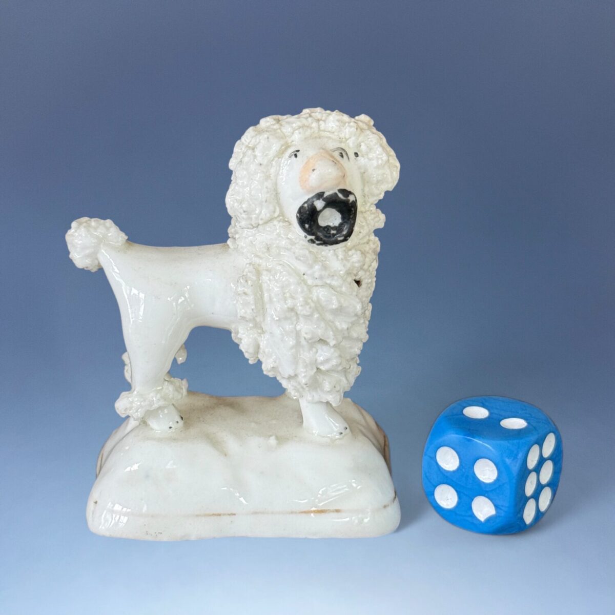 C19th Staffordshire Porcelain ‘Toy’  Poodle Holding a Hat.