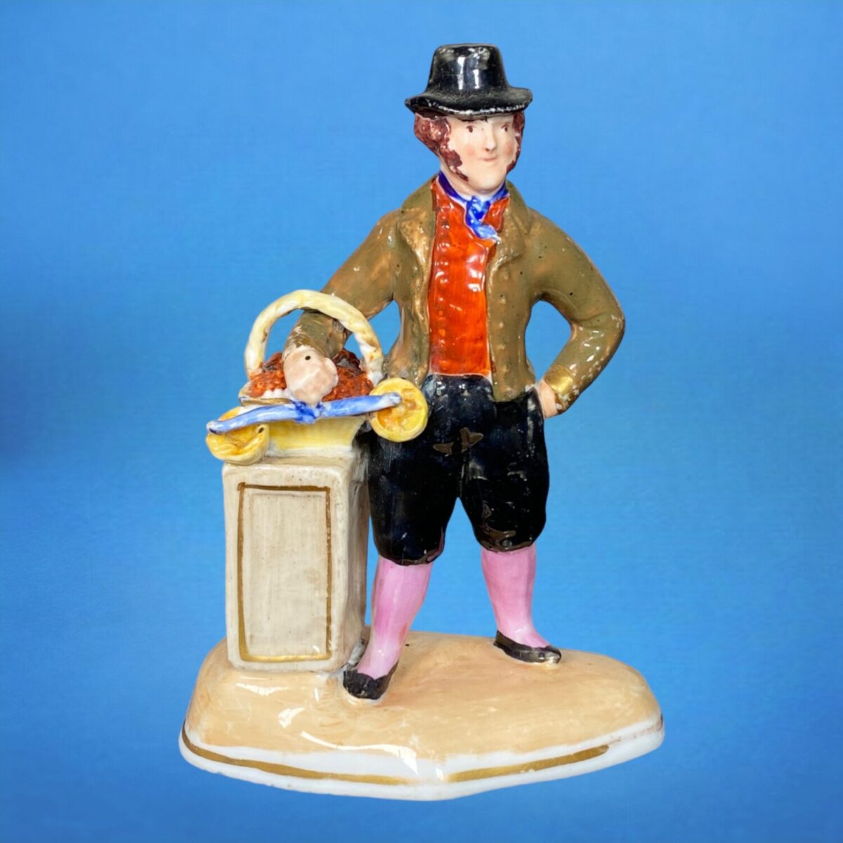 C19th Staffordshire Porcelain Figure of a Fruit Seller.