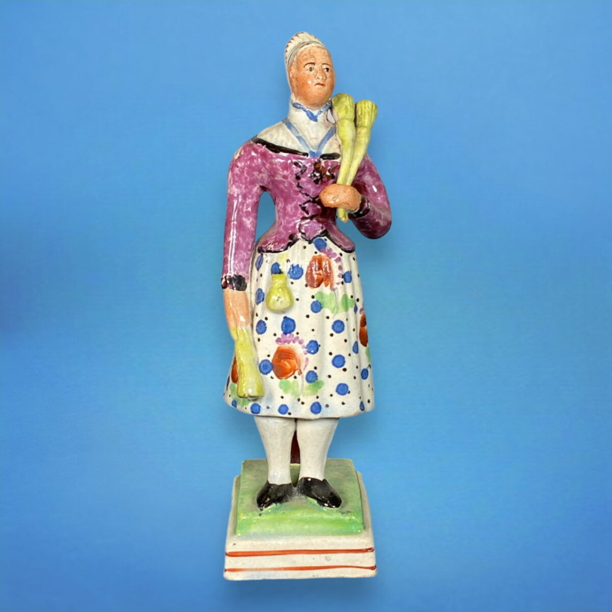 Staffordshire Figure of a Broom Seller.