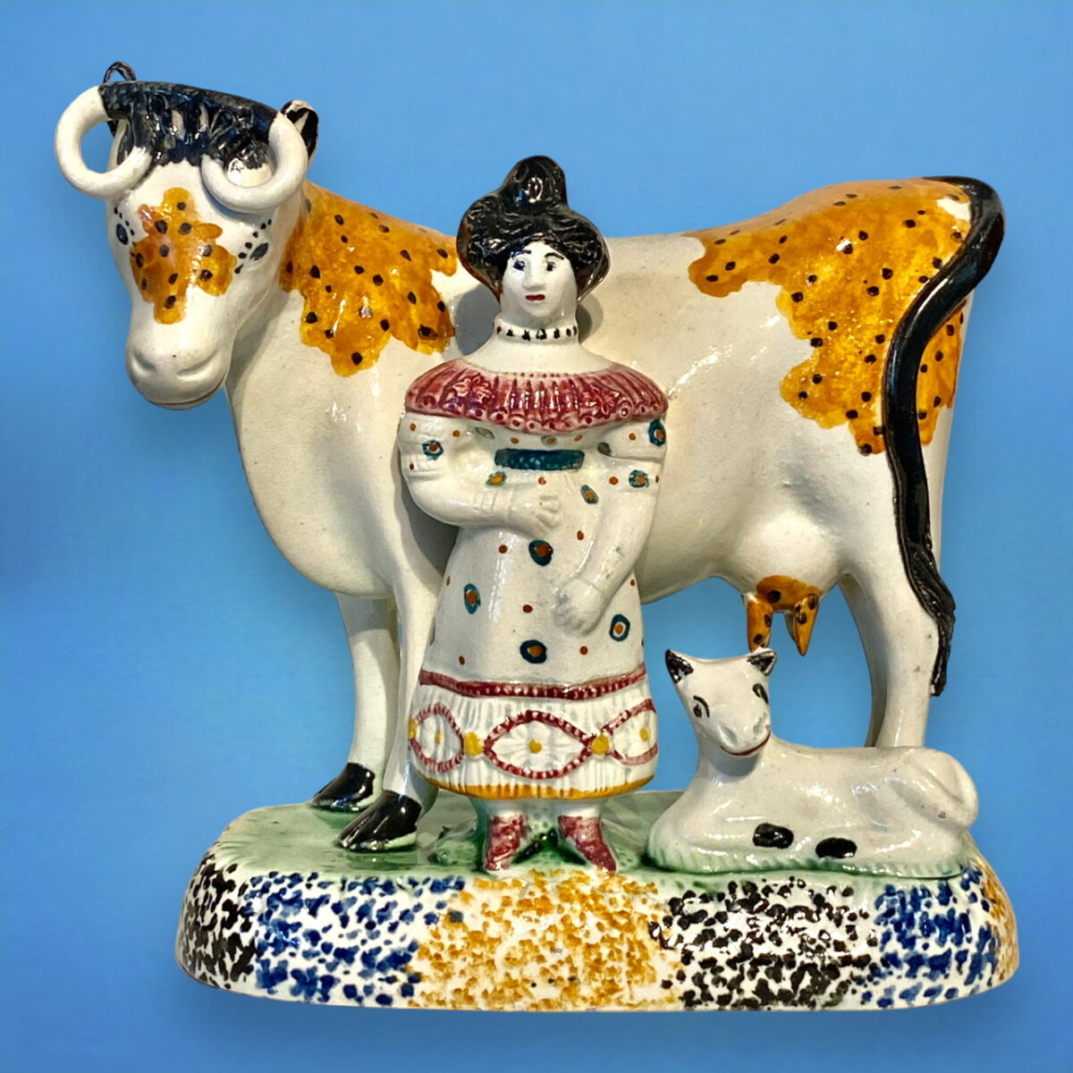 PrattWare Model of a Cow, With Female Attendant.