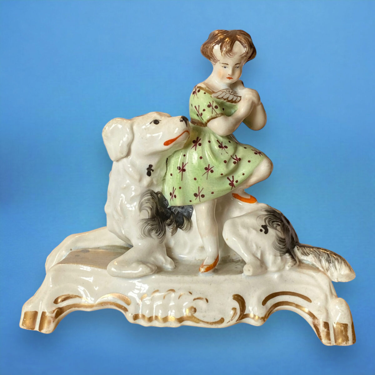 Staffordshire Porcelain Girl Sitting on a Dog.