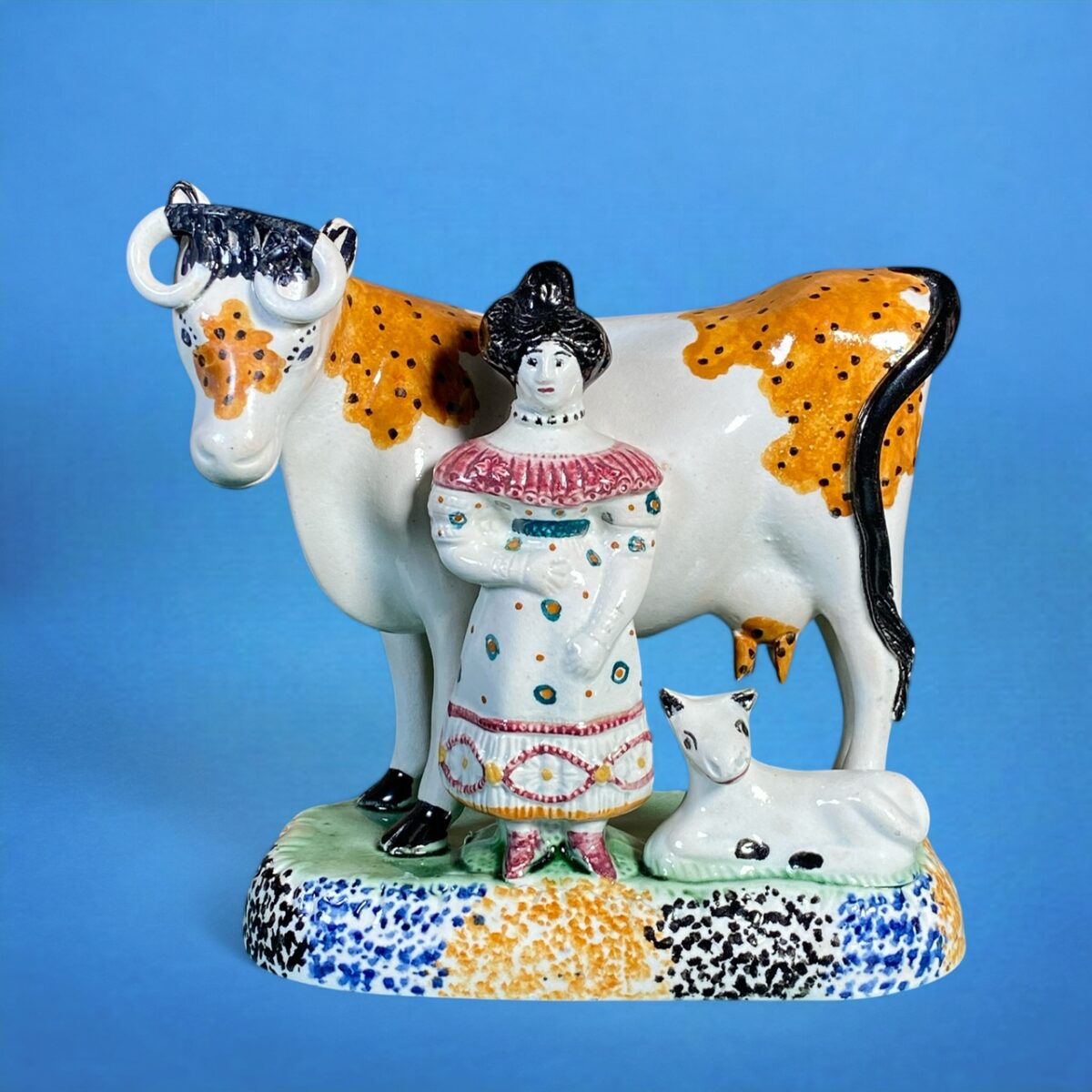 PrattWare Model of a Cow, With Female Attendant.