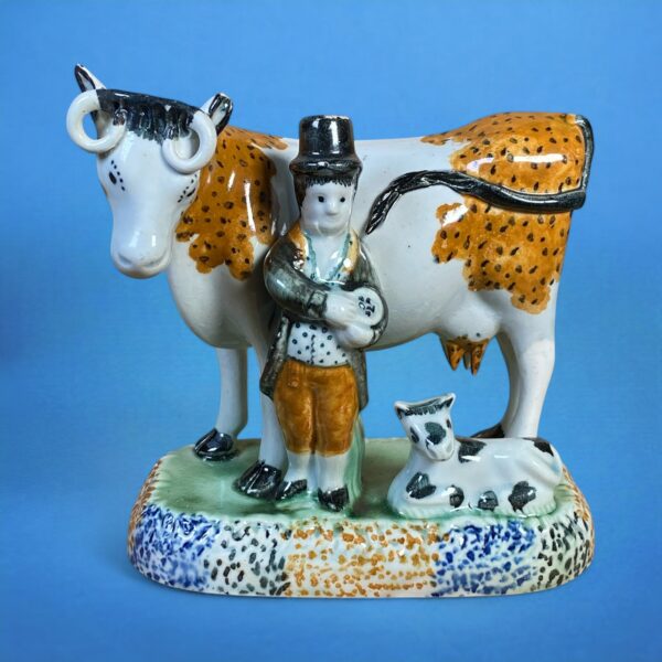 PrattWare Model of a Cow, With Male Attendant.