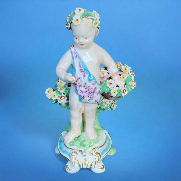 (Clearance) Chelsea-Derby Figure of a Putto With Basket of Flowers.