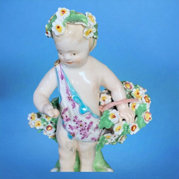 (Clearance) Chelsea-Derby Figure of a Putto With Basket of Flowers. - Image 6