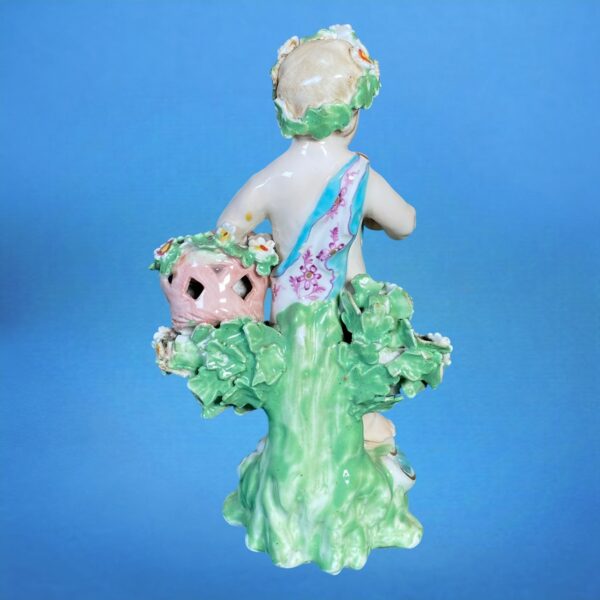 (Clearance) Chelsea-Derby Figure of a Putto With Basket of Flowers. - Image 4