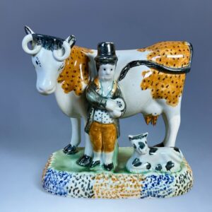 PrattWare Model of a Cow, With Male Attendant.