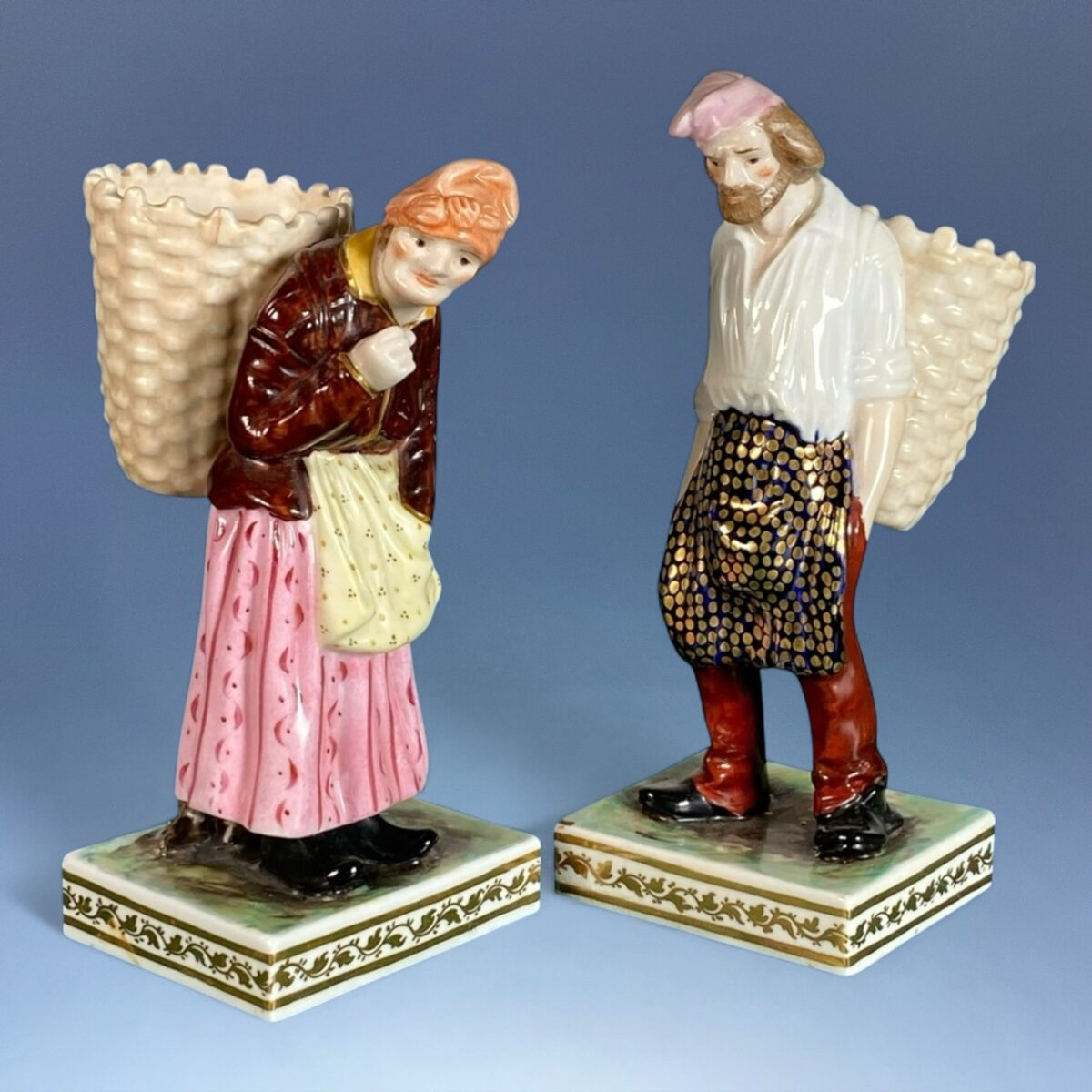 Pair of Crown Derby Porcelain Figures of Grape Harvesters.