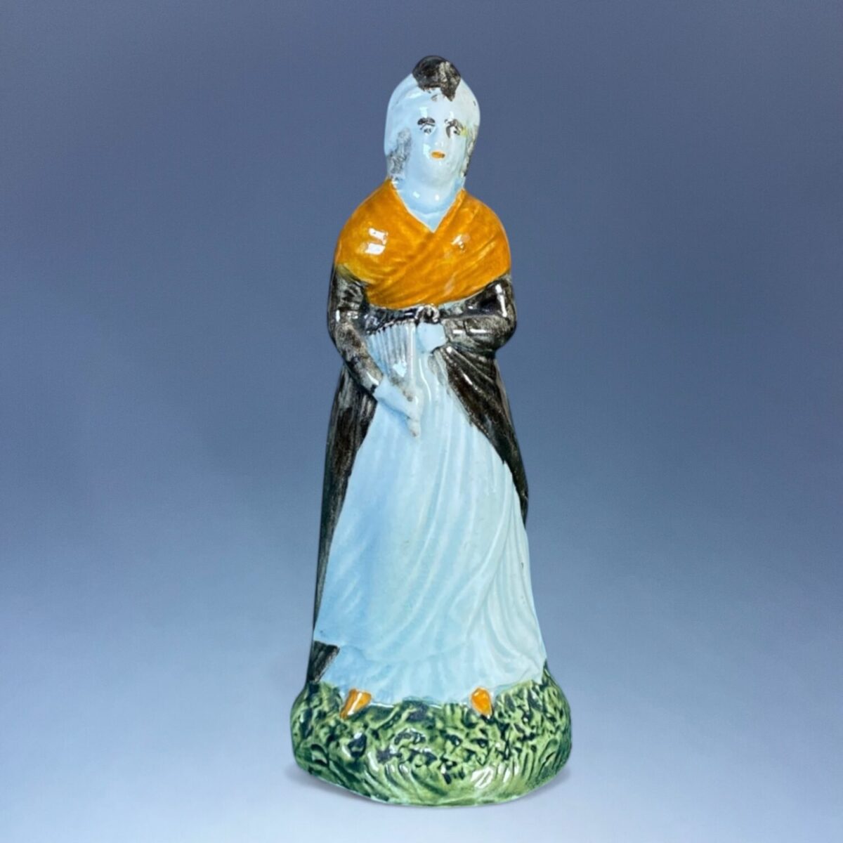 C18th Staffordshire Pottery Figure of a Woman Holding a Fan.