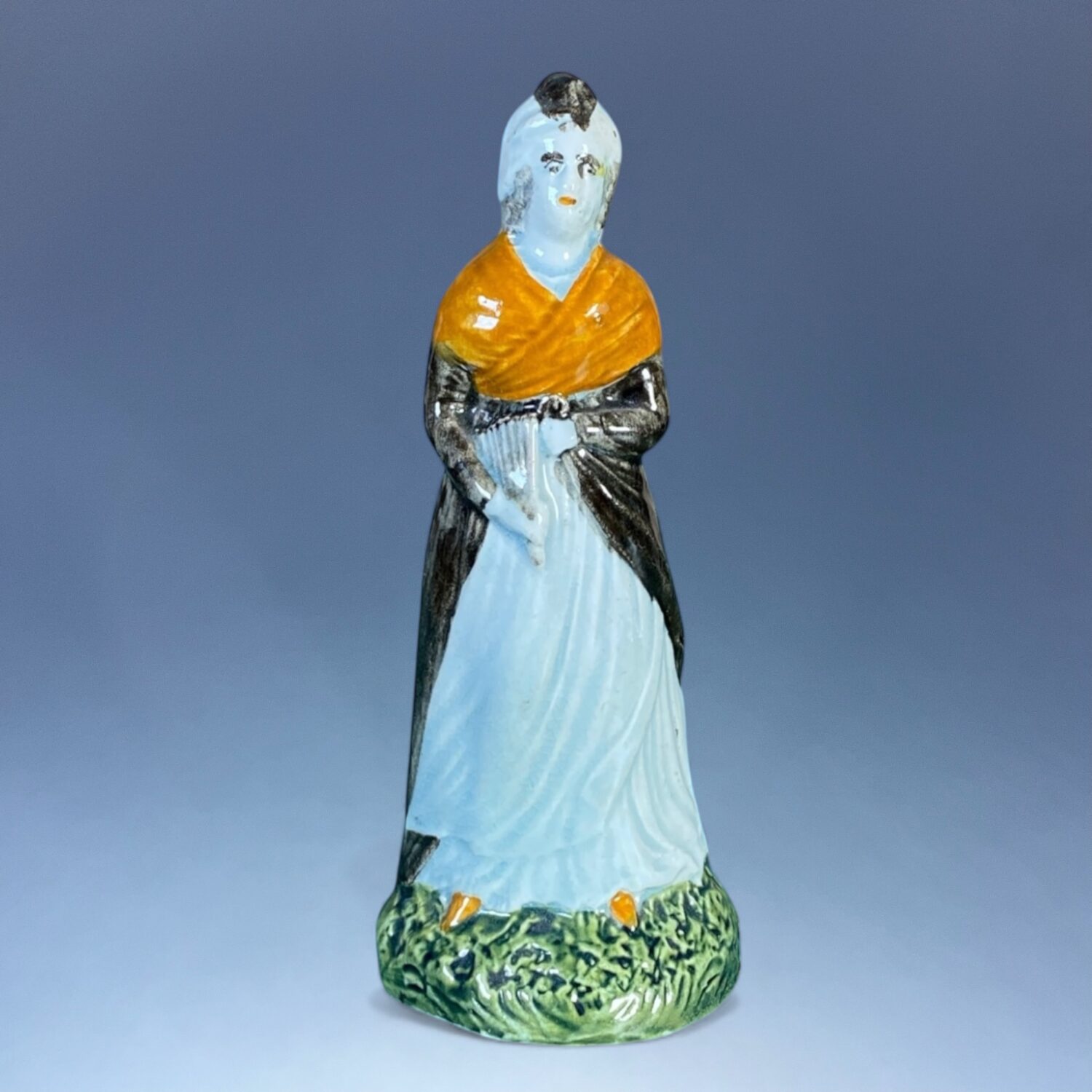 C18th Staffordshire Pottery Figure of a Woman Holding a Fan.
