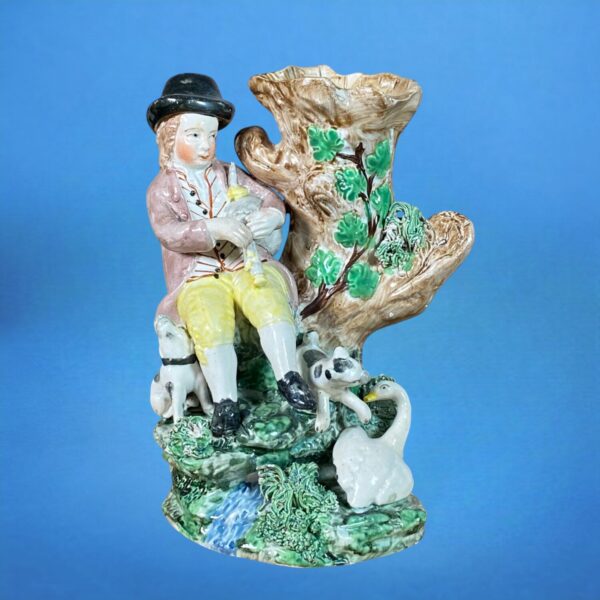 C19th Staffordshire Pottery Seated Piper Spill Holder.