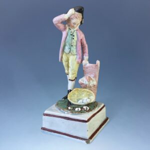 Staffordshire Pottery Figure - Boy With basket of Eggs