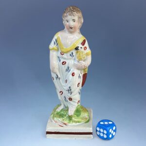 Staffordshire Pottery Small Figure - Girl Holding a Chicken.