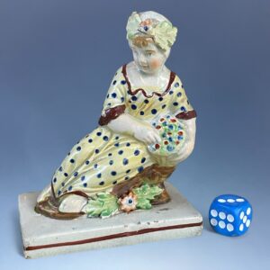 (Clearance) Staffordshire Pottery Small Figure - Girl With basket of Flowers.