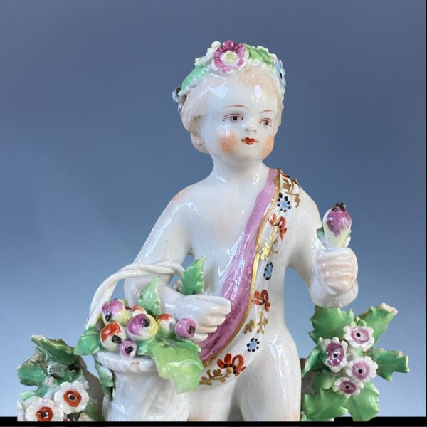 C18th BOW Porcelain - Small Figure of a Putto With Basket of Fruit. - Image 2