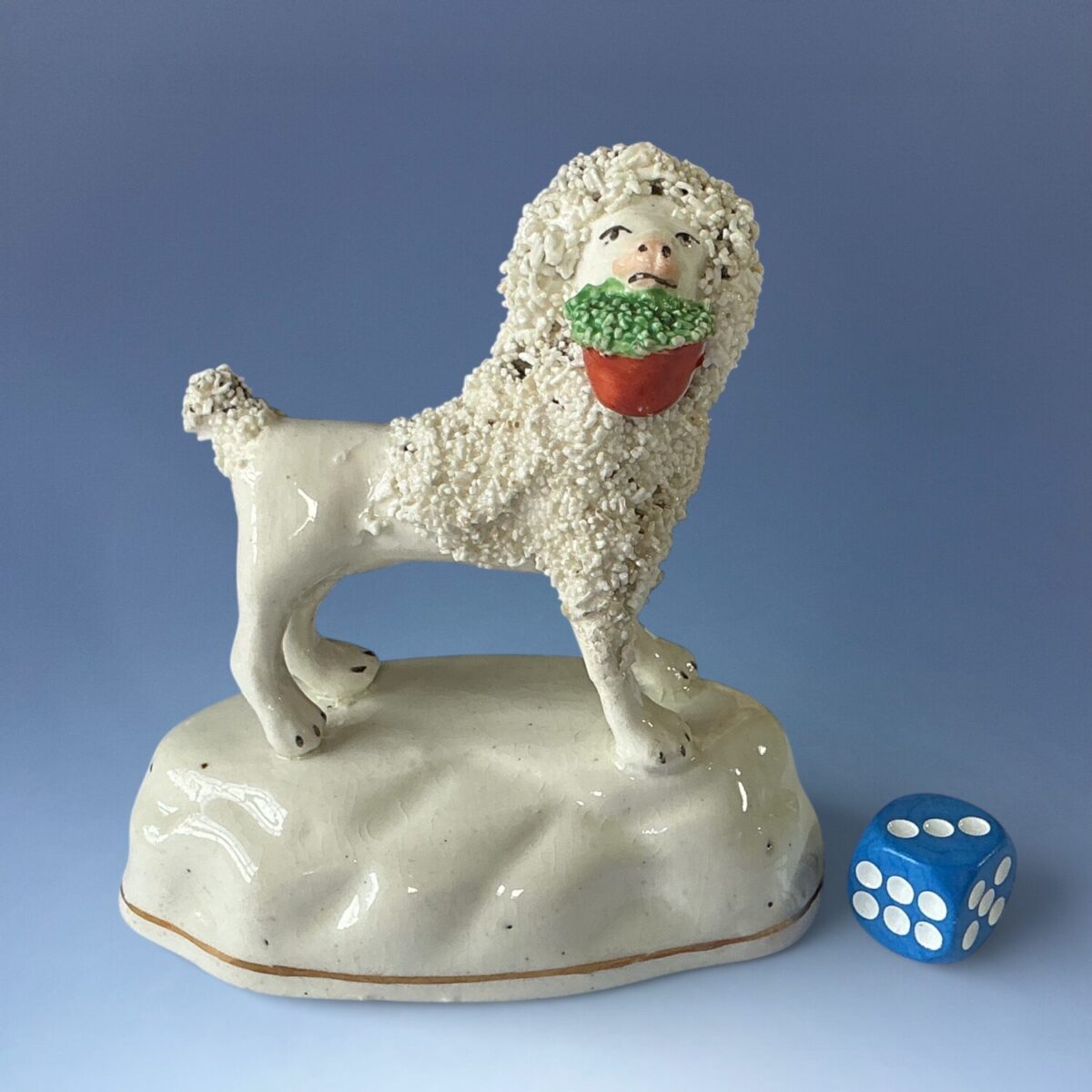 C19th Staffordshire Porcelain Poodle Carrying a Basket of Flowers