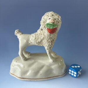 C19th Staffordshire Porcelain Poodle Carrying a Basket of Flowers