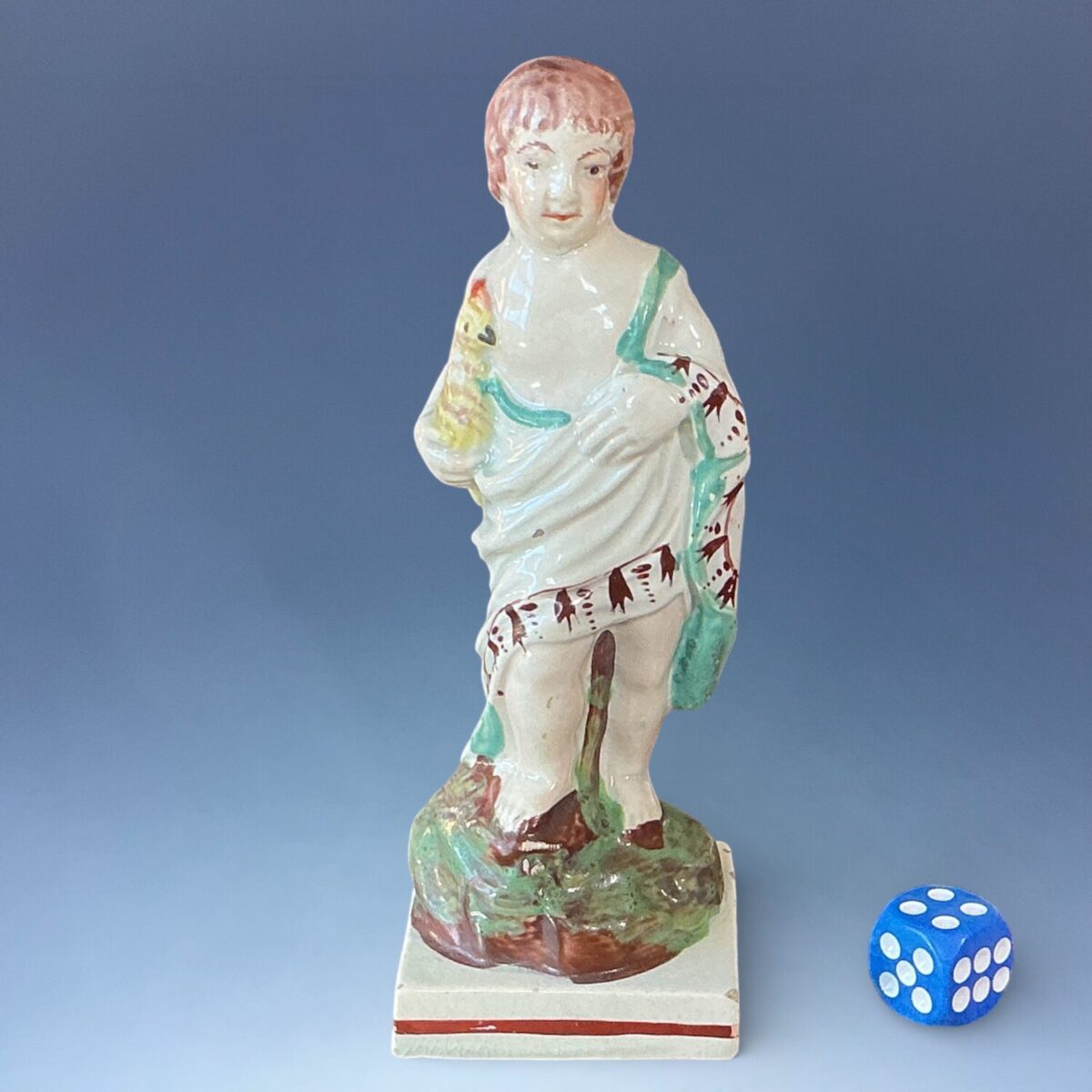 Early Staffordshire Small Figure of a Boy Holding a Cockerel.