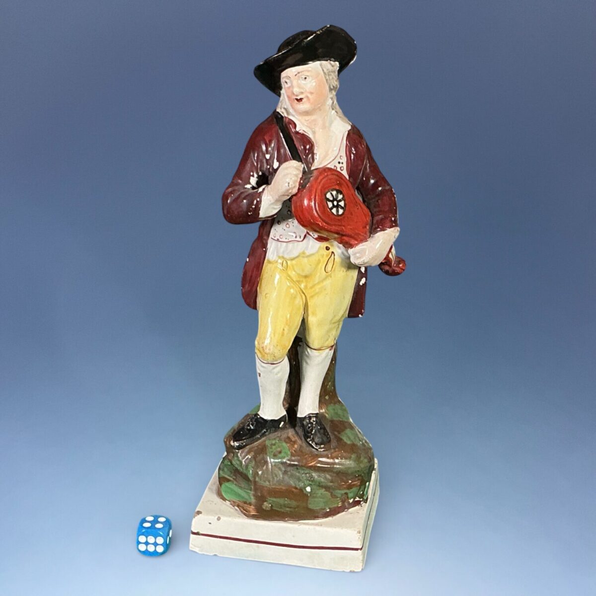 Early Staffordshire Pottery Figure of a Hurdy Gurdy Player.
