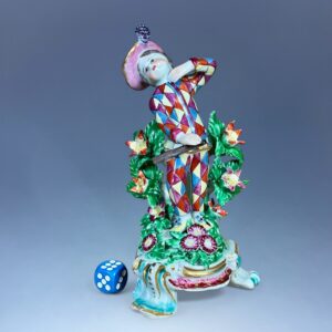 C18th Bow Porcelain Figure of a Young Boy Dressed as Harlequin