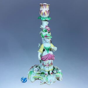 C18th Derby Porcelain Candlestick Figure of a Girl Holding a Flower.