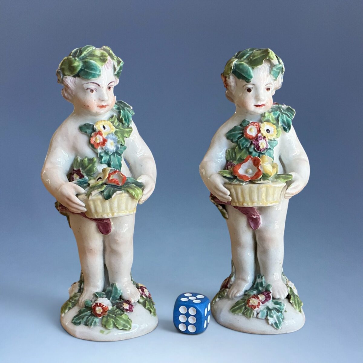 Pair of C18th Derby Porcelain Figures – Putti Holding Baskets of Flowers