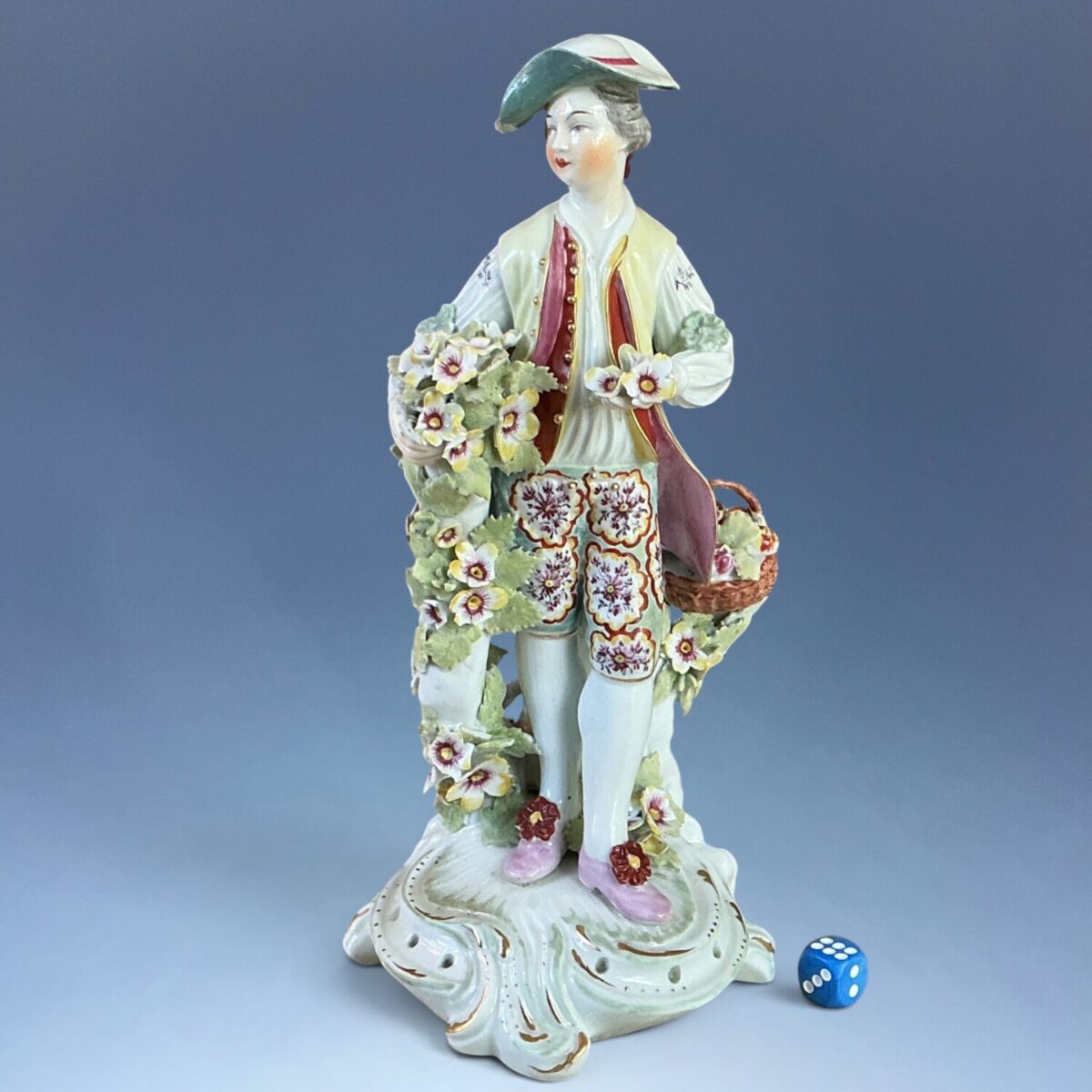 C18th Derby Figure of a Young Man With Basket of Flowers.