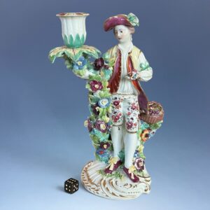 C18th Derby Figure of a Young Man With Basket of Fruit.