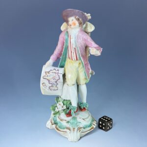 C18th Derby Figure of a Map Seller.